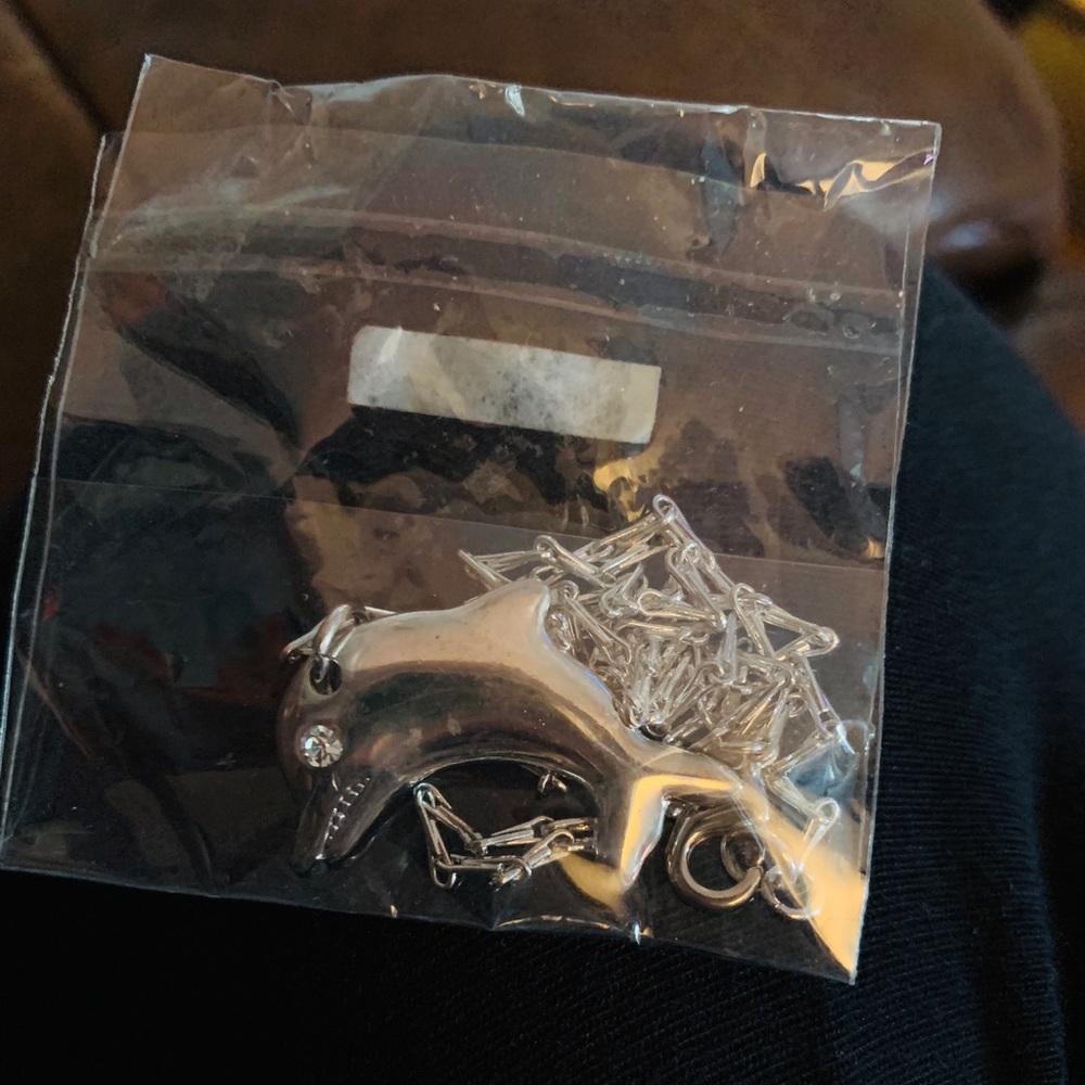 Brand new sterling silver dolphin necklace